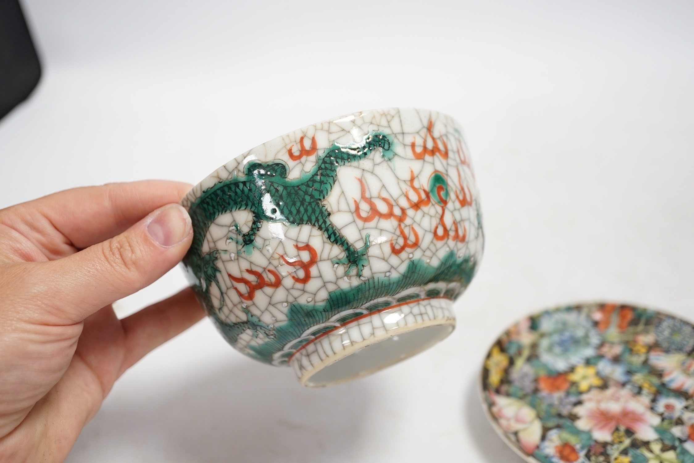 A Chinese crackleglaze famille verte ‘dragon’ bowl and a millefleur cup and saucer, bowl 11cm diameter. Condition - fair
